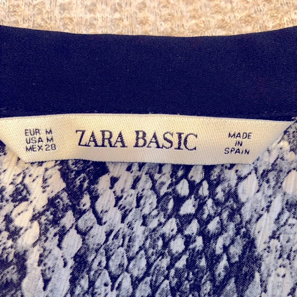 Zara black and cream snake print popover tunic blouse